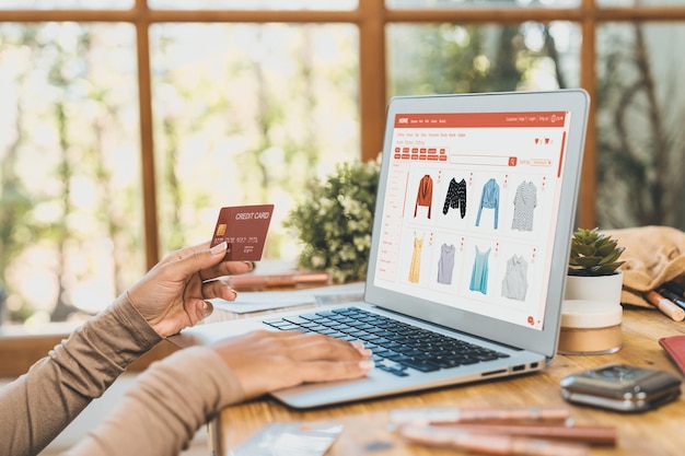 Woman shopping online on internet marketplace browsing for sale items for modern lifestyle and use credit card for online payment from wallet protected by crucial cyber security software