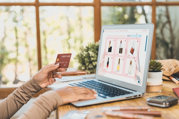 Woman shopping online on internet marketplace browsing for sale items for modern lifestyle and use credit card for online payment from wallet protected by crucial cyber security software