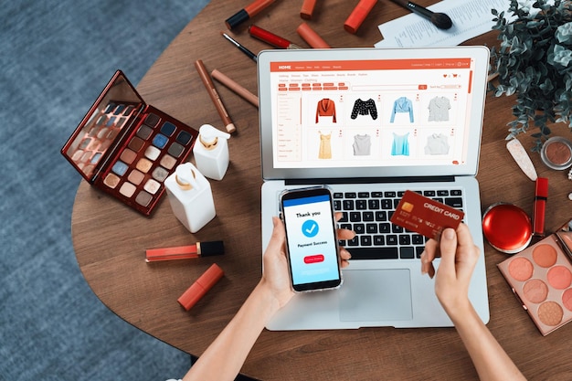 Woman shopping online on internet marketplace browsing for sale items for modern lifestyle and use credit card for online payment from wallet protected by utmost cyber security software