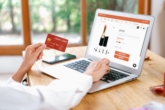 Woman shopping online on internet marketplace browsing for uttermost sale items