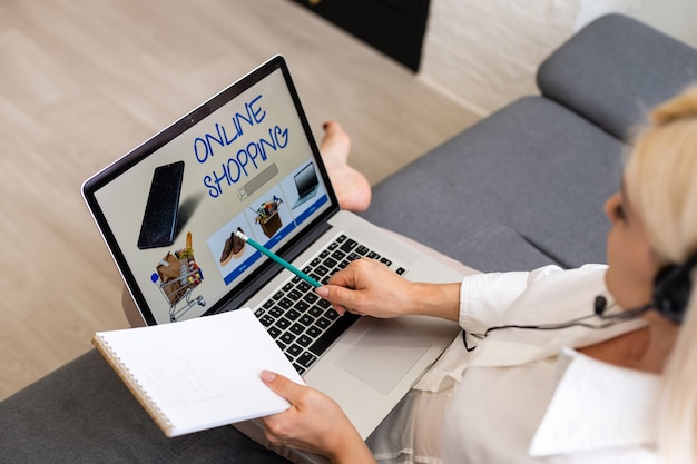 Woman shopping using laptop and ads