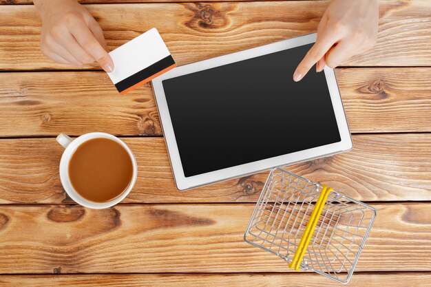 Woman shopping using tablet pc and credit card