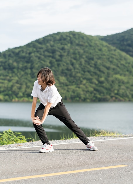 Woman short hair doing exercising outdoor