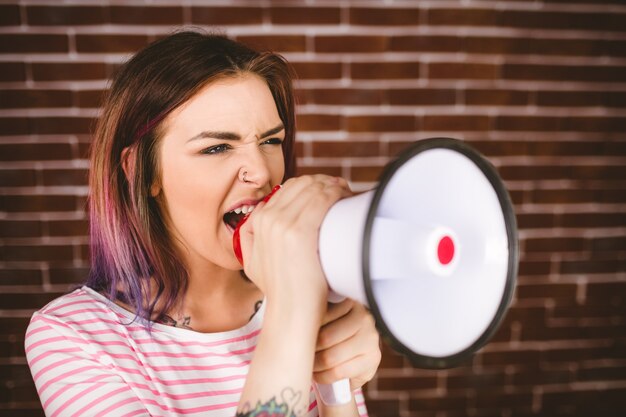 Photo woman shouting on megaphone