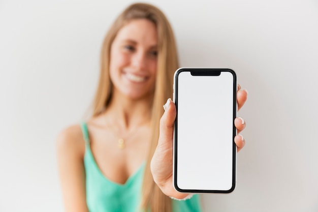 Woman showing blank phone