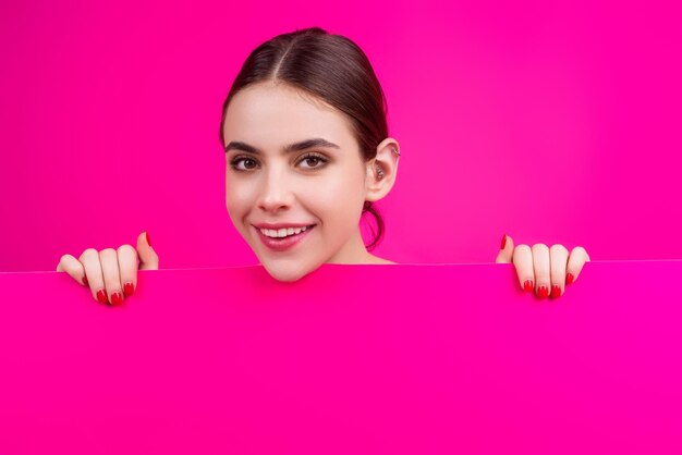 woman showing blank signboard girl holding a blank paper isolated background sheet of paper in hands