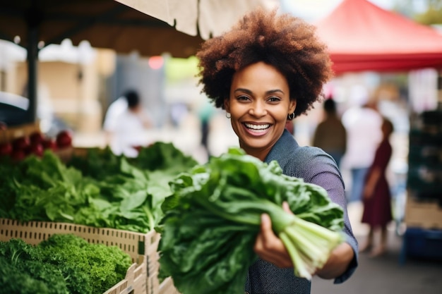 Woman showing freshly harvested vegetables at a farmers market