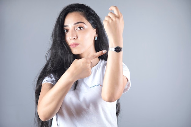 Woman showing the hand watch