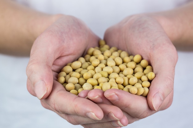 Woman showing handful of chickpeas