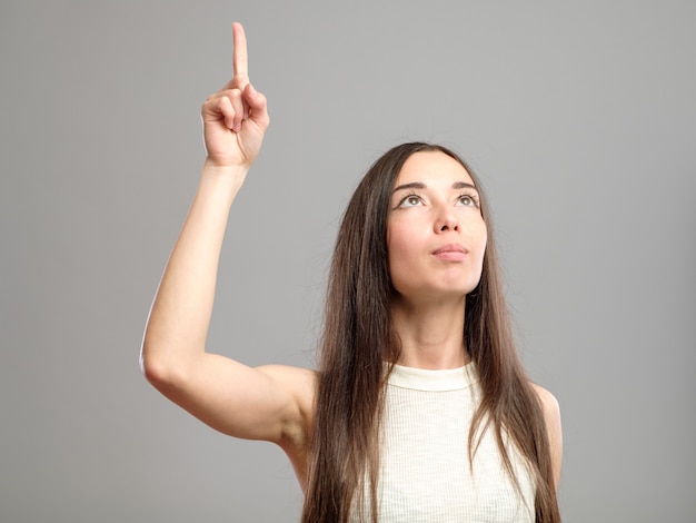 Woman showing her index finger up