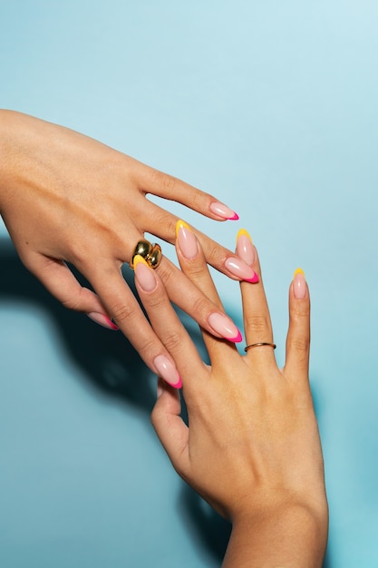 Woman showing her nail art on fingernails
