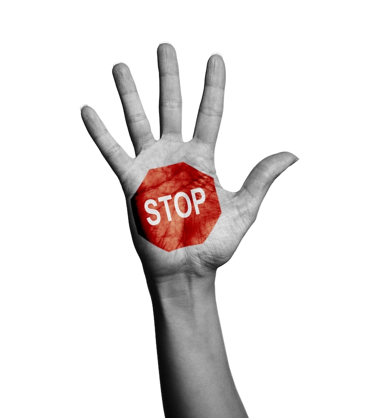 Photo woman showing palm with drawn stop sign on white background closeup