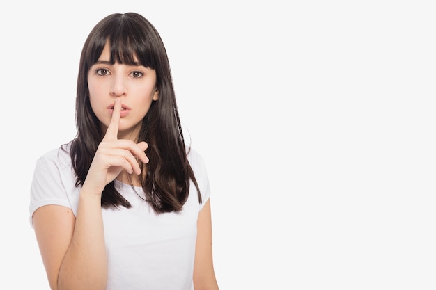 Photo woman showing silence gesture