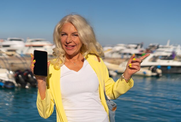 Woman showing smartphone