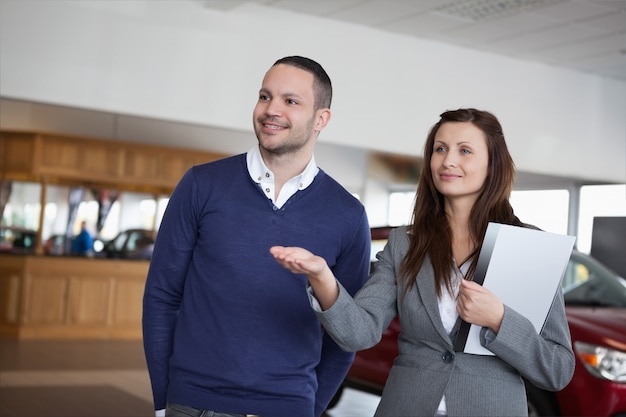 Woman showing something to a man