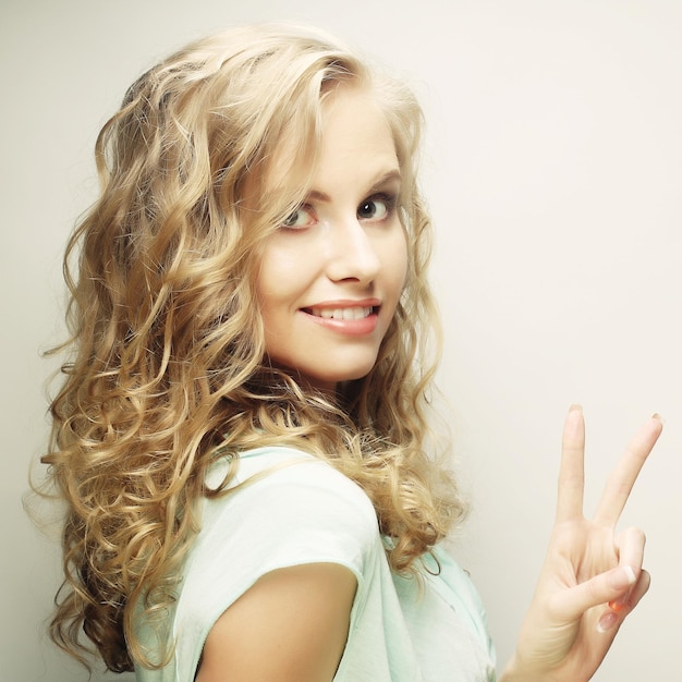 Woman showing victory or peace sign