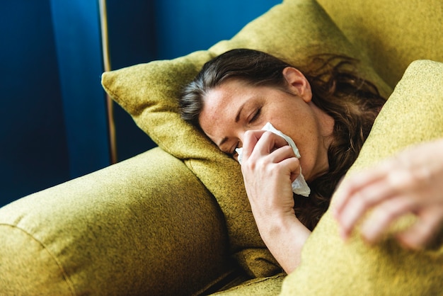 Woman sick on the sofa