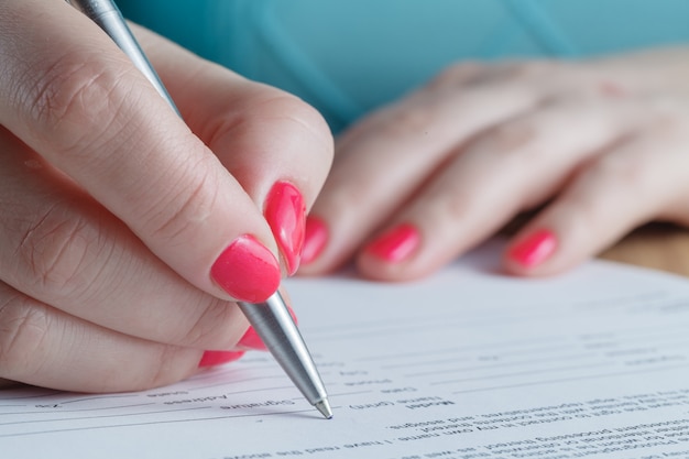 Woman signing contract