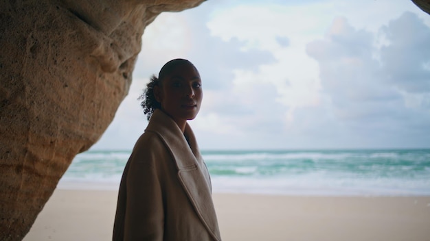 Woman silhouette ocean cave at cloudy sky beautiful serene model exploring