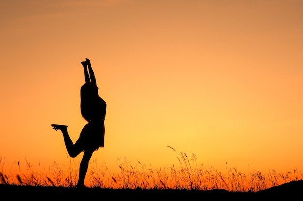 Woman silhouette in the sunset 