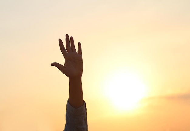 woman silhouette to the sunset