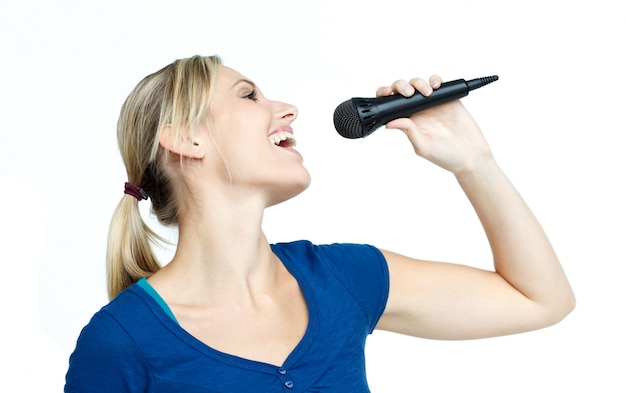 Woman singing on a microphone