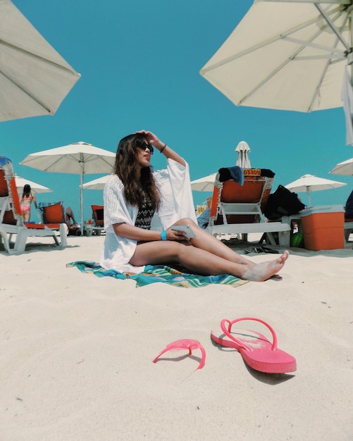 woman sitting on beach