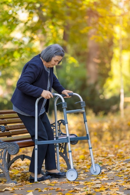 Woman sitting on bench in park