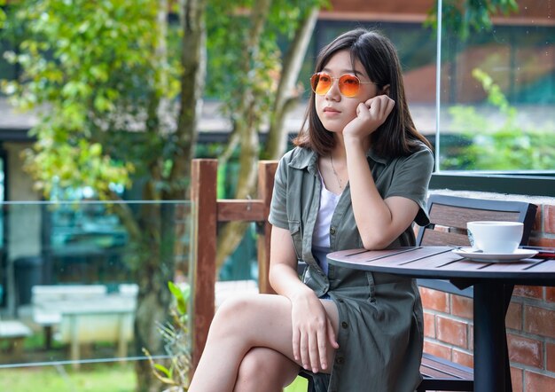 Woman sitting in a cafe terrace