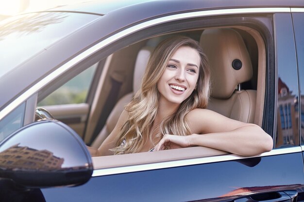 Woman sitting in the car and looking away