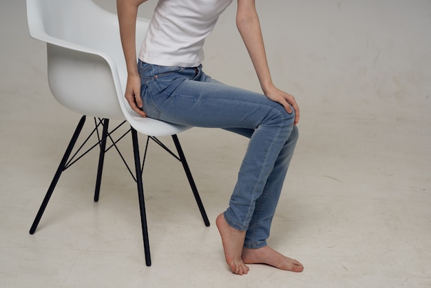 Woman sitting on a chair leg injury health problems