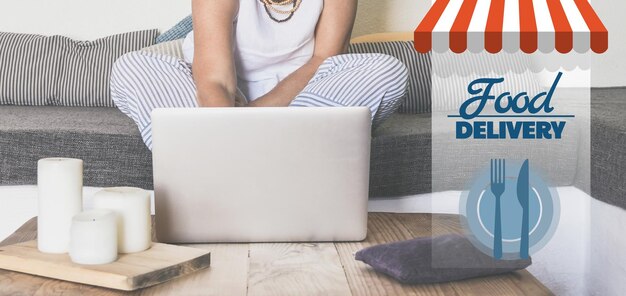 Woman sitting on the couch behind computer order and pay food online home delivery catering concept