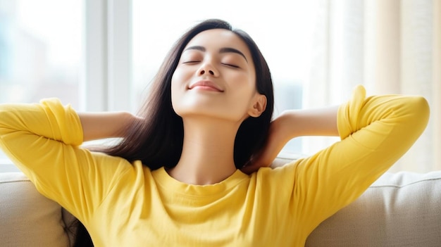 a woman sitting on a couch with her eyes closed