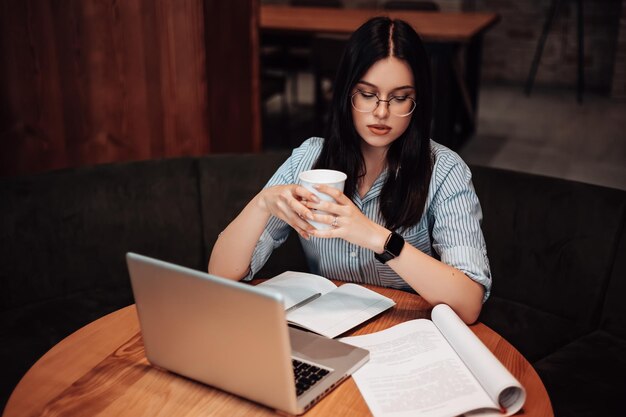 Woman sitting and drink coffee