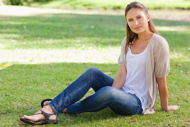 Woman sitting on the lawn