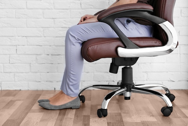 Woman sitting on the office chair indoors