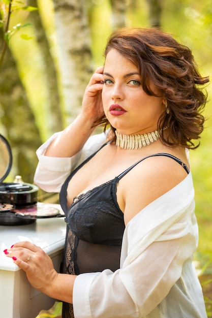 Woman sitting and posing in the forest