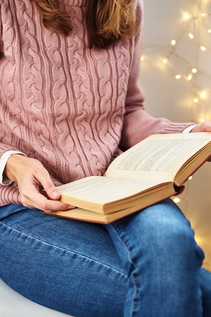 Woman sitting and reading book. Relaxing concept