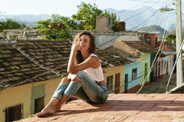 Woman sitting on the roof