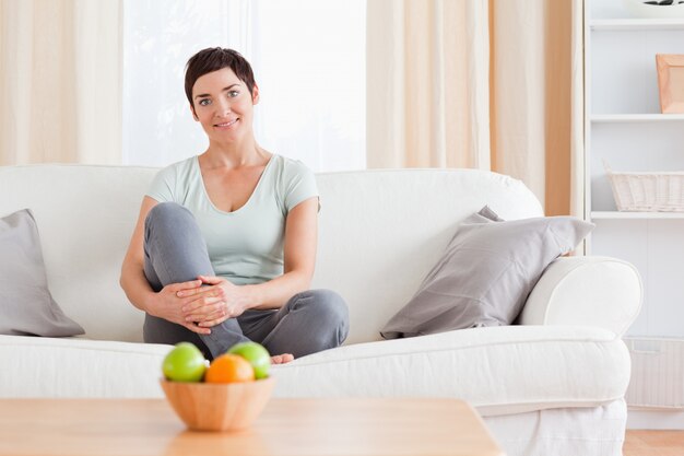 Woman sitting on a sofa