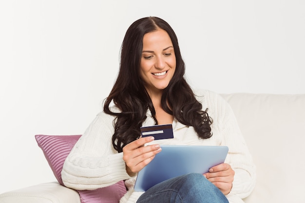 Woman sitting with tablet pc