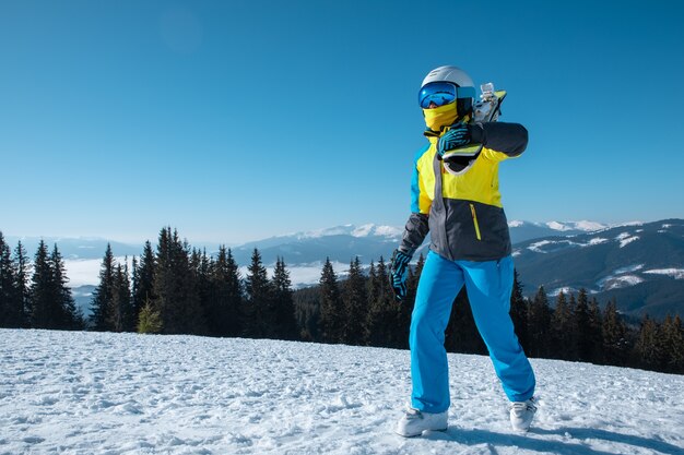 Woman skier portrait with ski on the top of the mountains winter vacation