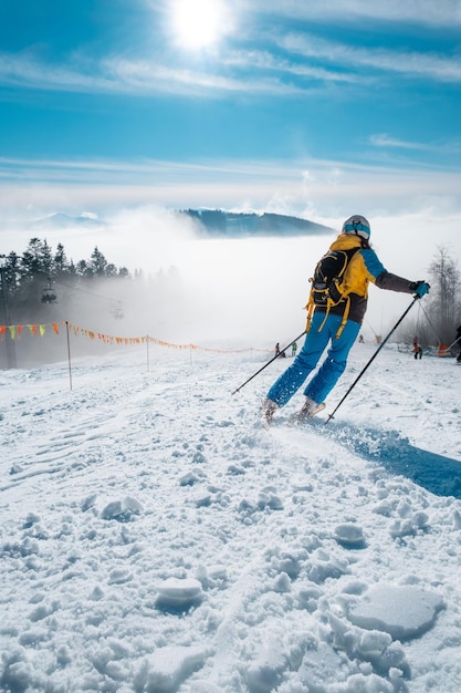 Woman skier at ski slop winter resort