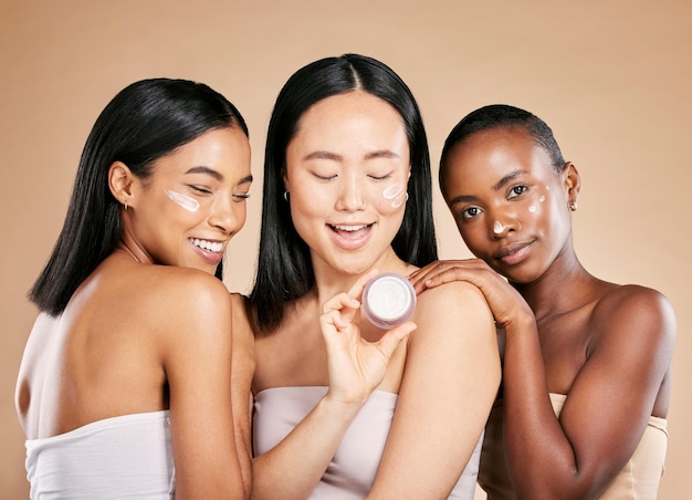 Woman skincare and face cream product in studio for wellness skin and grooming on brown background Facial mask and friends relax for beauty sunscreen and lotion luxury and pamper while isolated