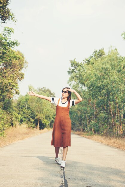 Woman skirt and sneaker shoes Walking on the road and park