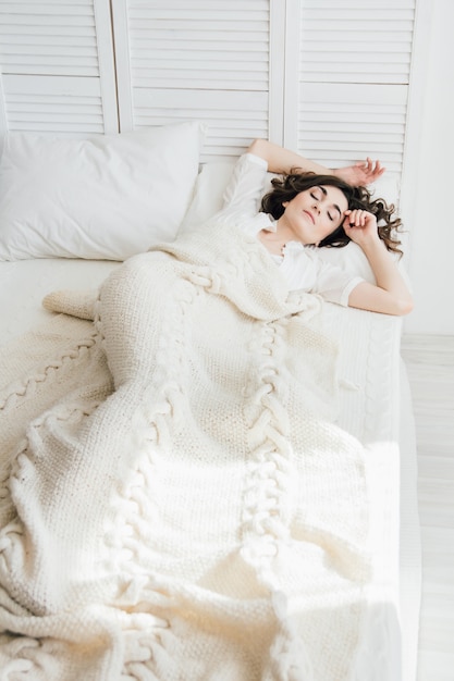 Woman sleeping in bed 