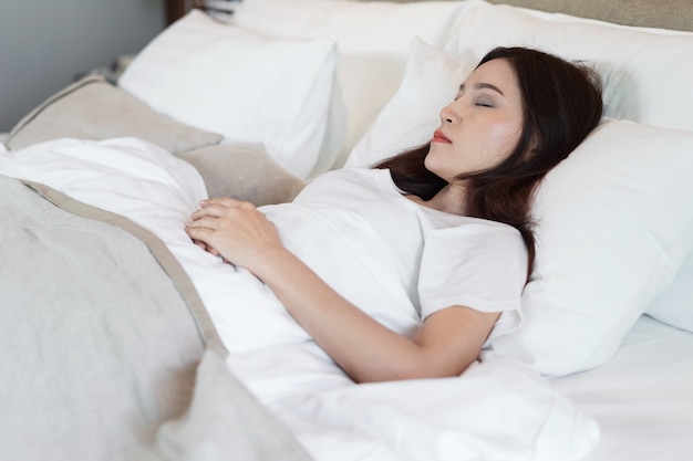 woman sleeping on a bed