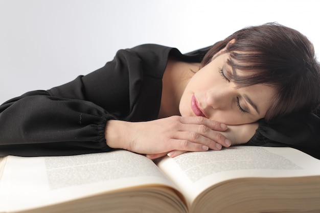 Woman sleeping on a book