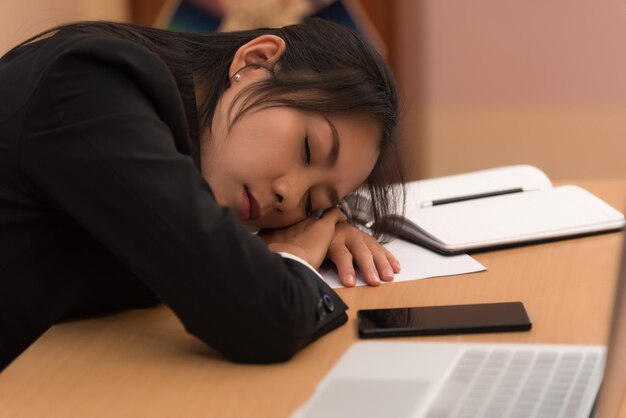 Woman sleeping on table