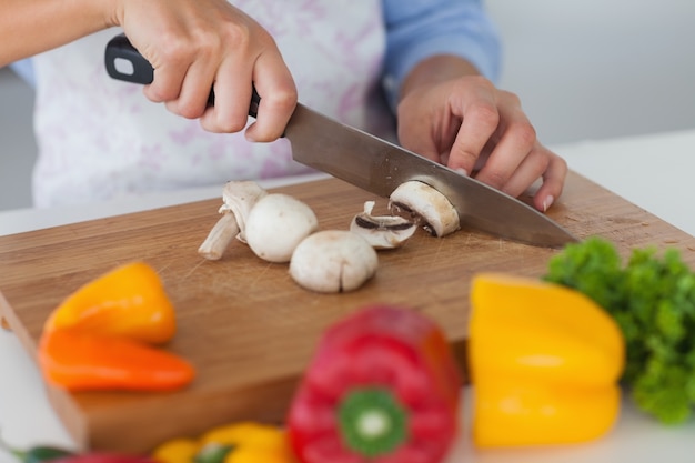 Woman slicing mushrooms